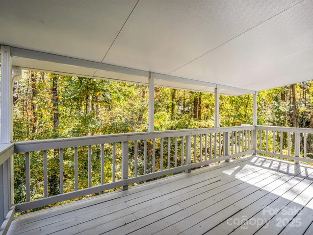a view of balcony with wooden floor