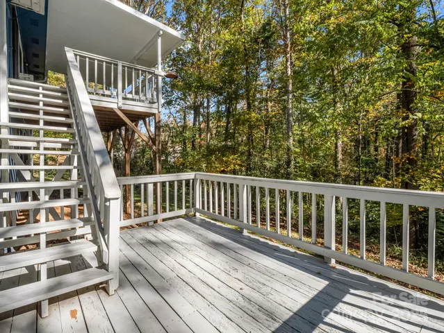 a view of balcony with wooden floor