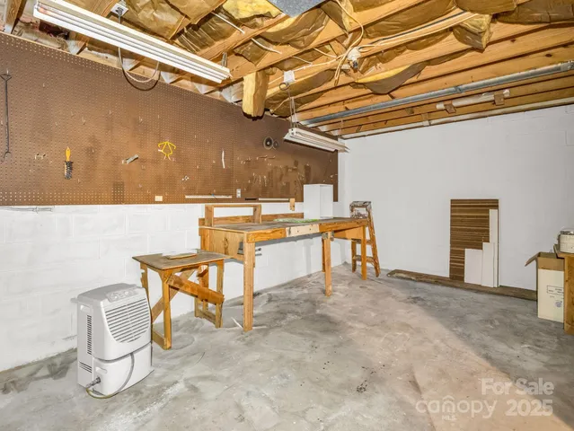 a view of a kitchen with a sink and cabinets