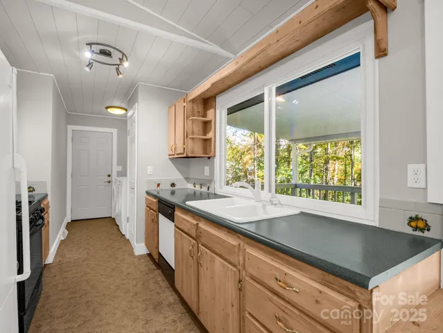 a kitchen with a sink and a window