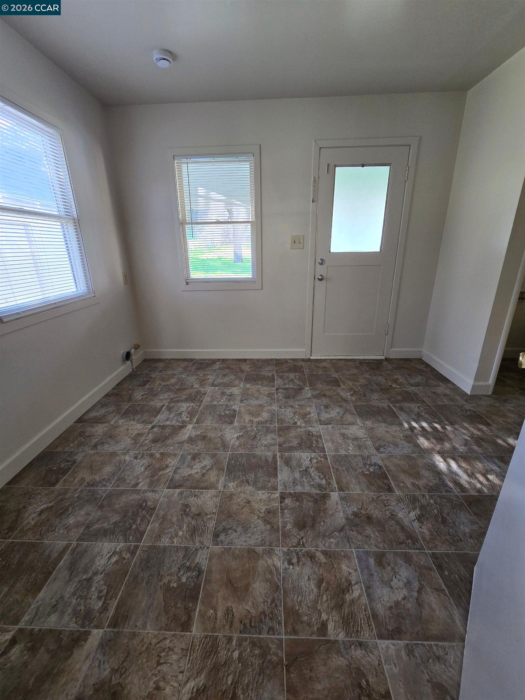 4455 Appian Way El Sobrante, CA 94803 - Photo 1 of 12 a view of an empty room with a window