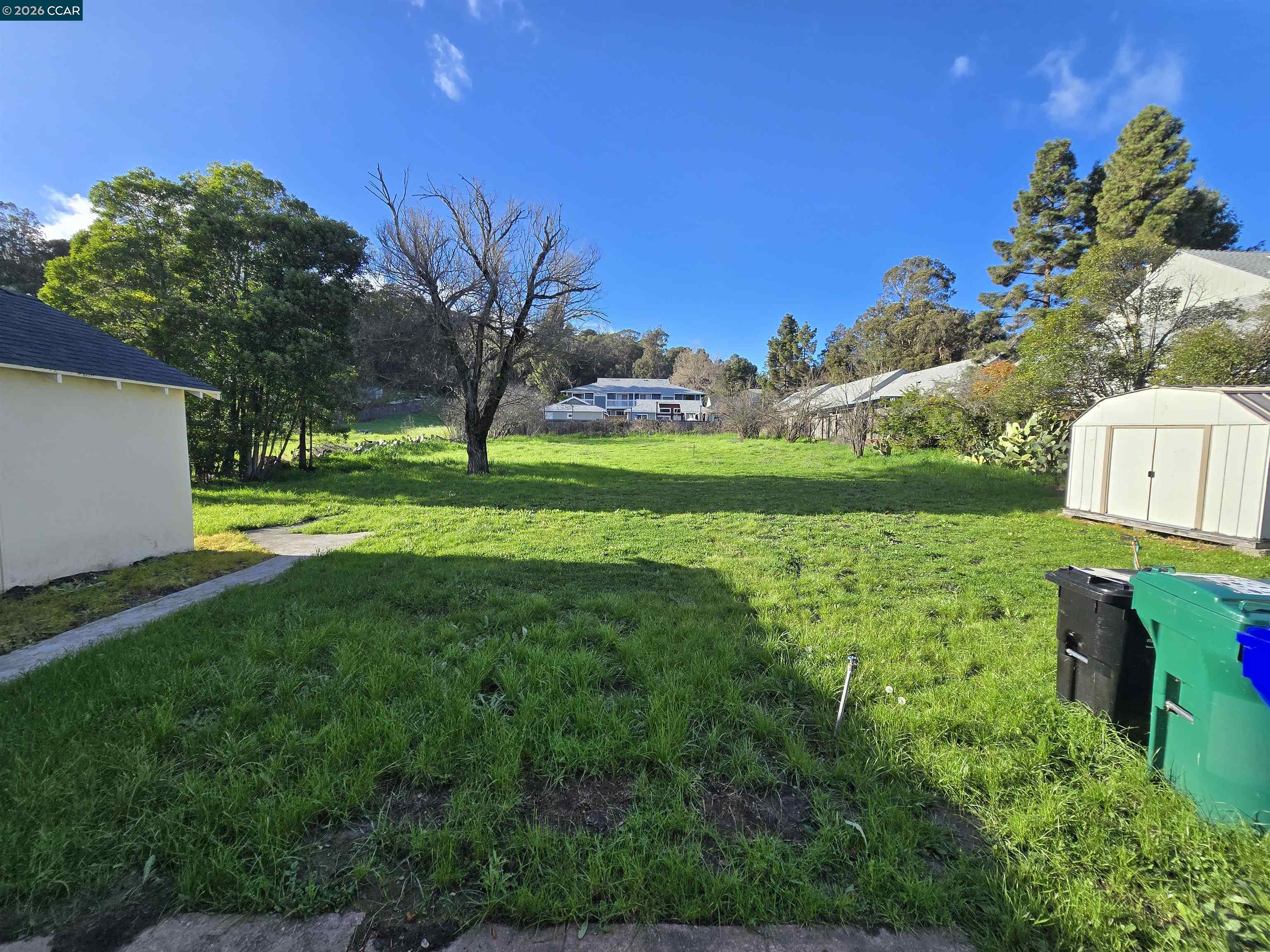 4455 Appian Way El Sobrante, CA 94803 - Photo 3 of 12 a view of a golf course with a garden