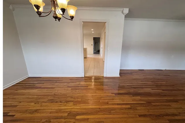 a view of wooden floor and a sink in a room