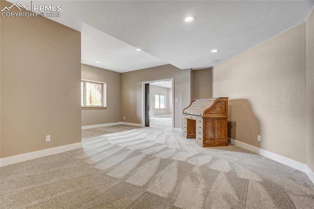 17165 Goshawk Road Colorado Springs, CO 80908 - Photo 49 of 50 a view of a livingroom with a workspace