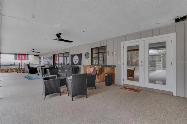 a view of a livingroom with furniture and windows