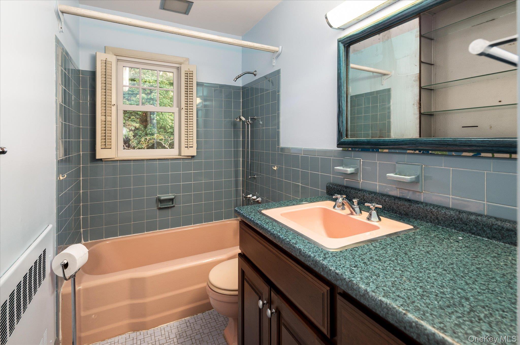 131 Allison Road Katonah, NY 10536 - Photo 16 of 28 a bathroom with a granite countertop tub a sink and a large mirror