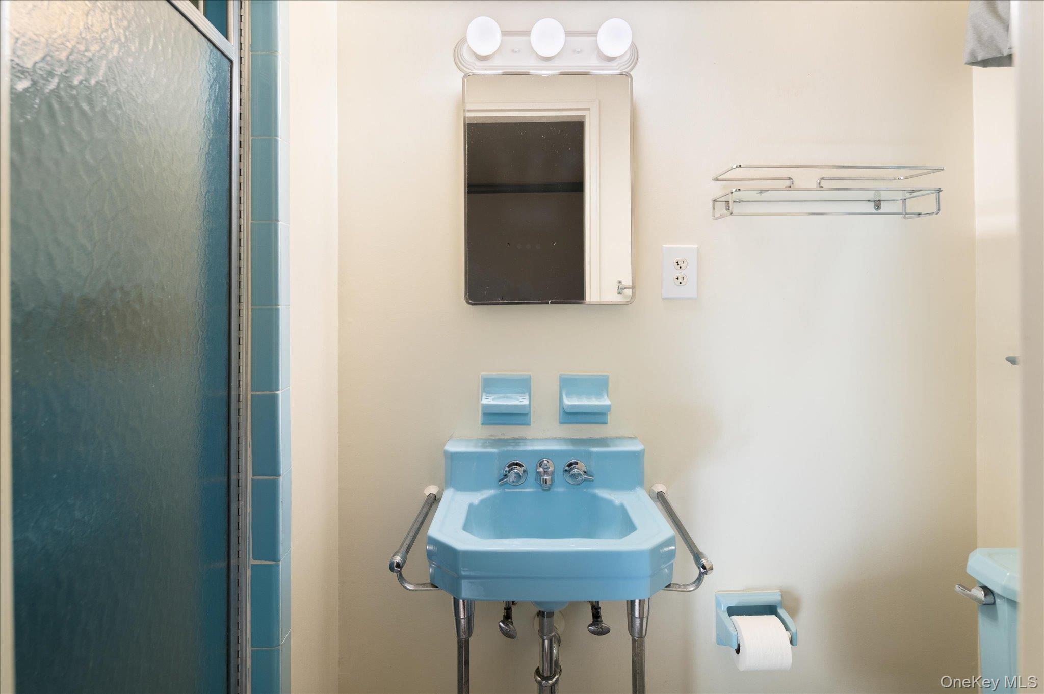 131 Allison Road Katonah, NY 10536 - Photo 23 of 28 a bathroom with a sink and a mirror