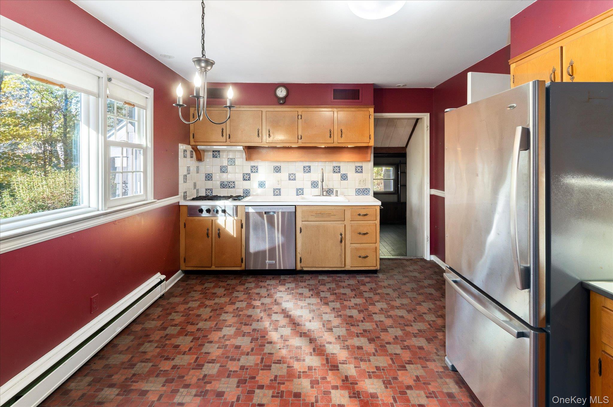 131 Allison Road Katonah, NY 10536 - Photo 6 of 28 a kitchen with stainless steel appliances a refrigerator sink and stove