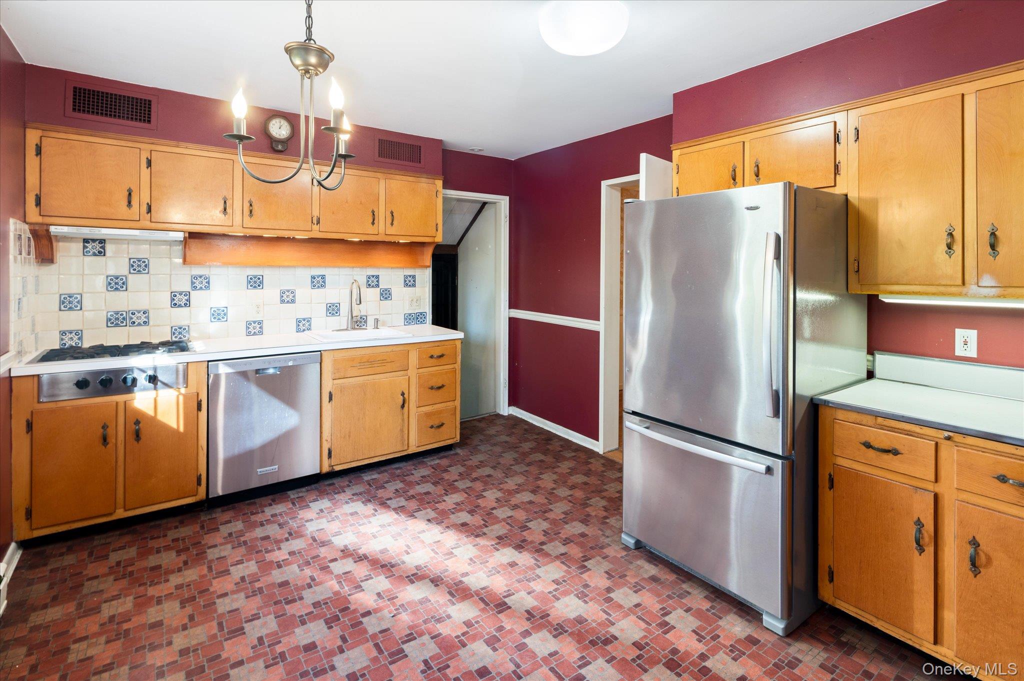 131 Allison Road Katonah, NY 10536 - Photo 7 of 28 a kitchen with stainless steel appliances granite countertop a refrigerator a stove and a sink
