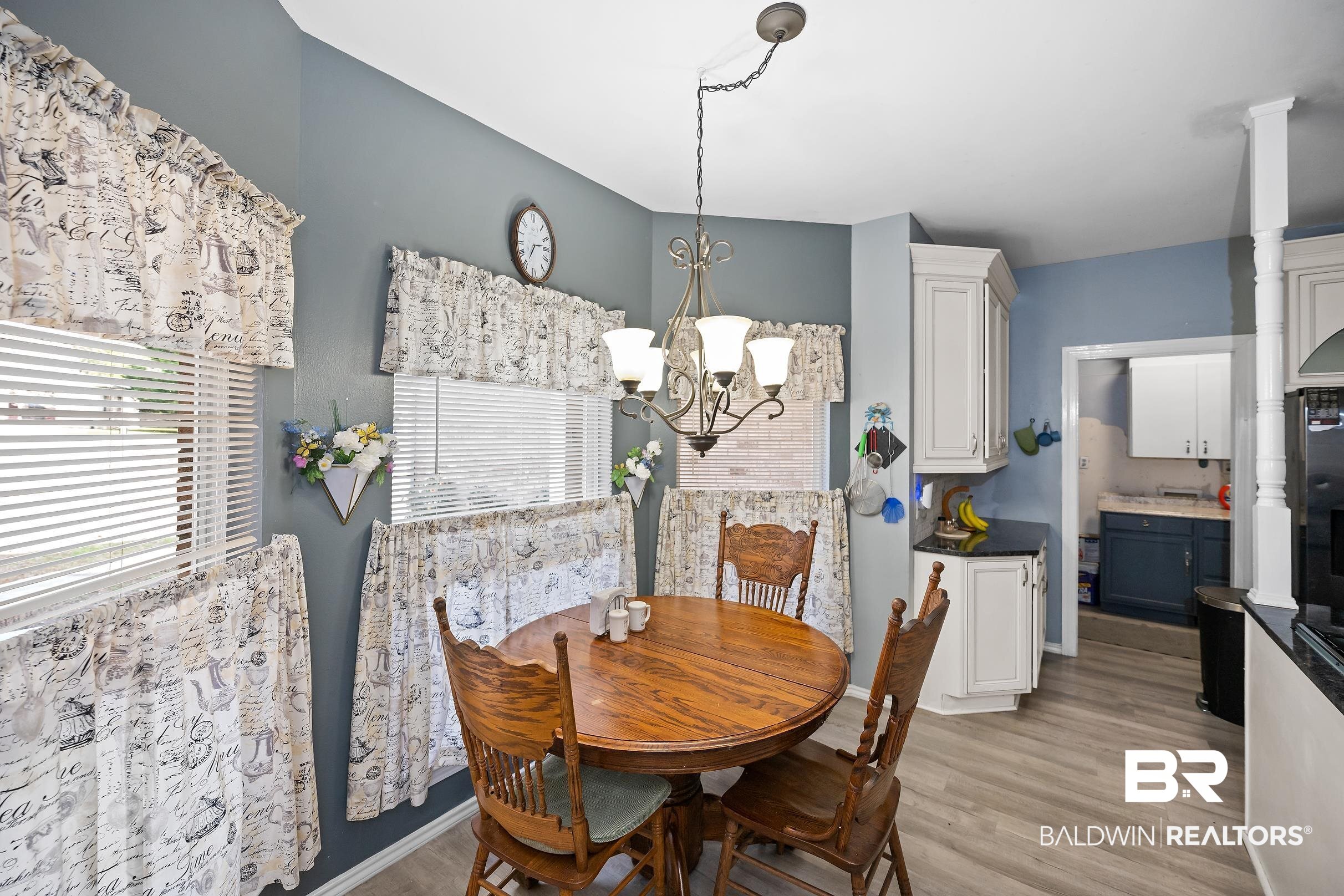 2674 Pine Ridge Drive Lillian, AL 36549 - Photo 9 of 42 Dining room with a chandelier and light wood-style flooring