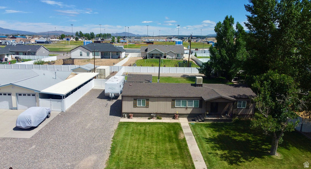 855 East 300 N Street Beaver, UT 84713 - Photo 42 of 44 Single-story residence featuring a well-maintained lawn and mature trees