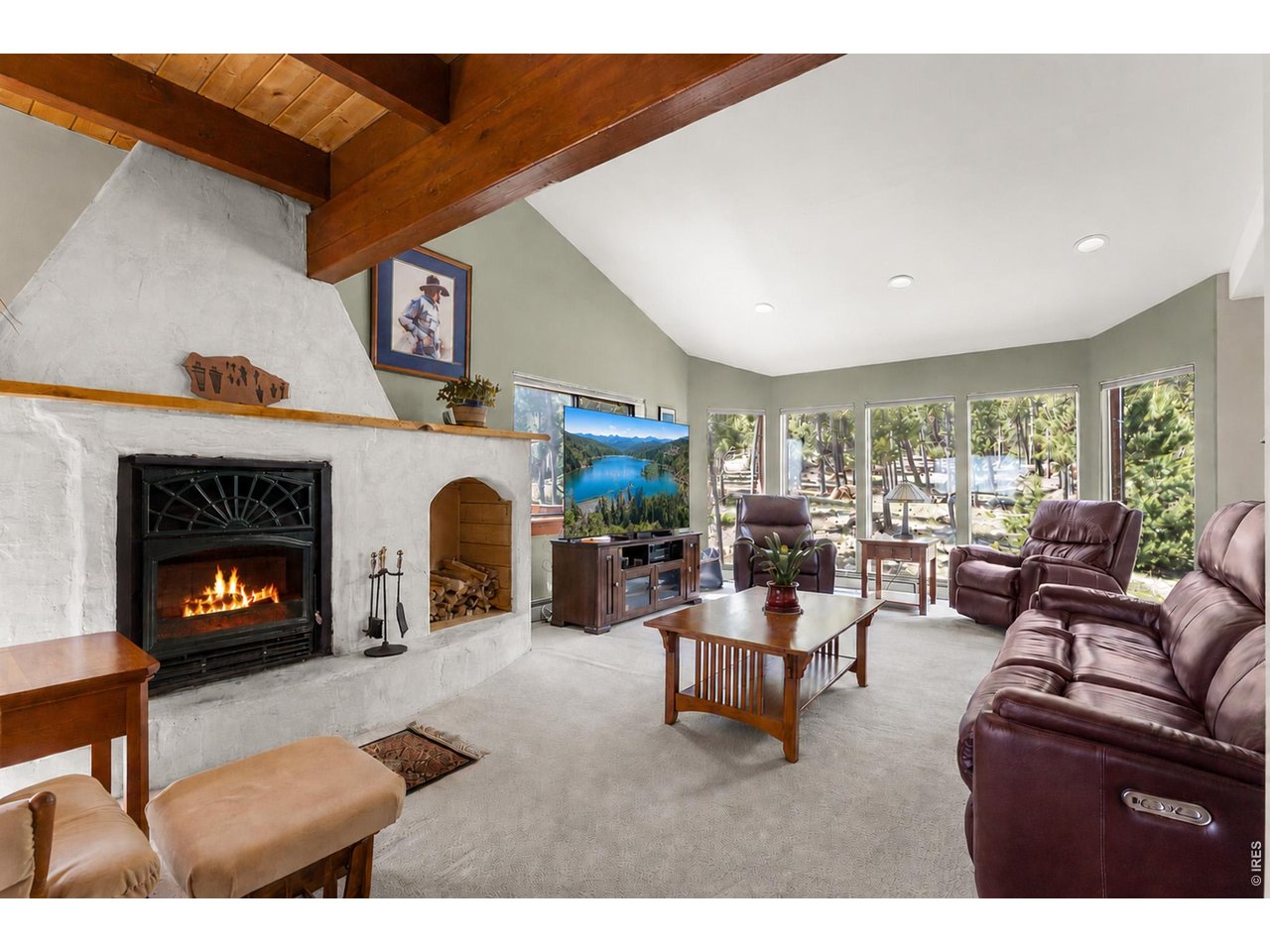1109 Indian Peak Road Golden, CO 80403 - Photo 13 of 50 Wood fireplace and high ceilings