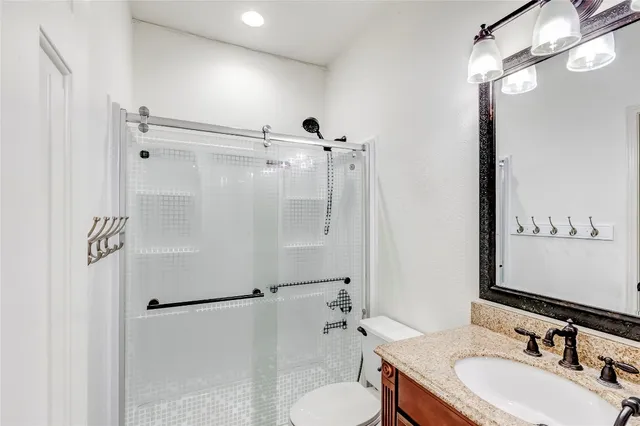 a large kitchen with stainless steel appliances granite countertop a sink and a large window