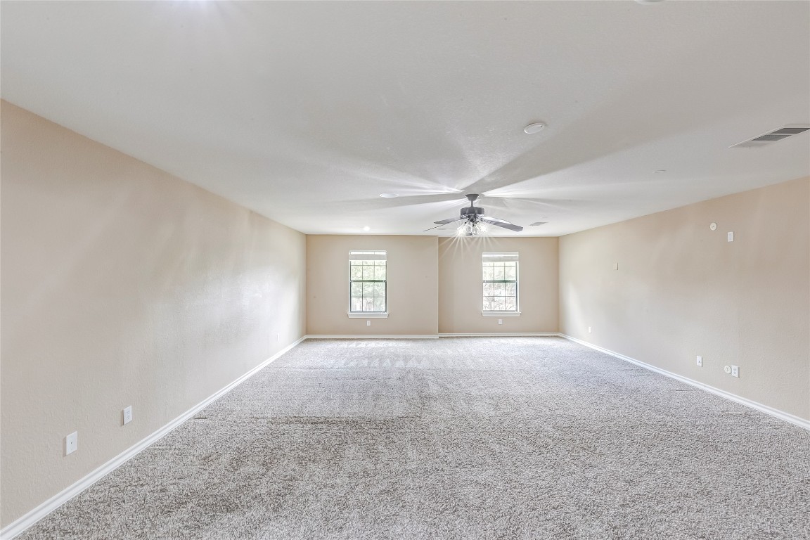 2310 McKendrick Drive Cedar Park, TX 78613 - Photo 19 of 32 a view of a big room with windows and cabinet