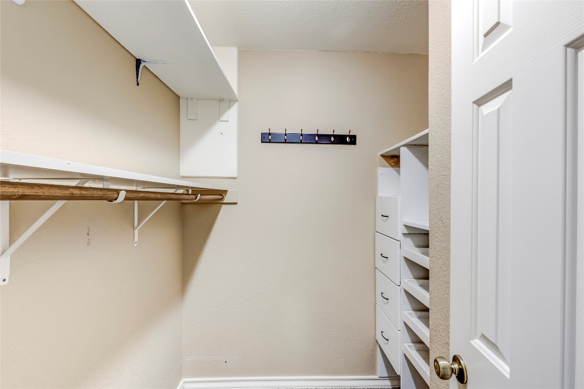 2310 McKendrick Drive Cedar Park, TX 78613 - Photo 21 of 32 a view of walk in closet with clothes and shoes