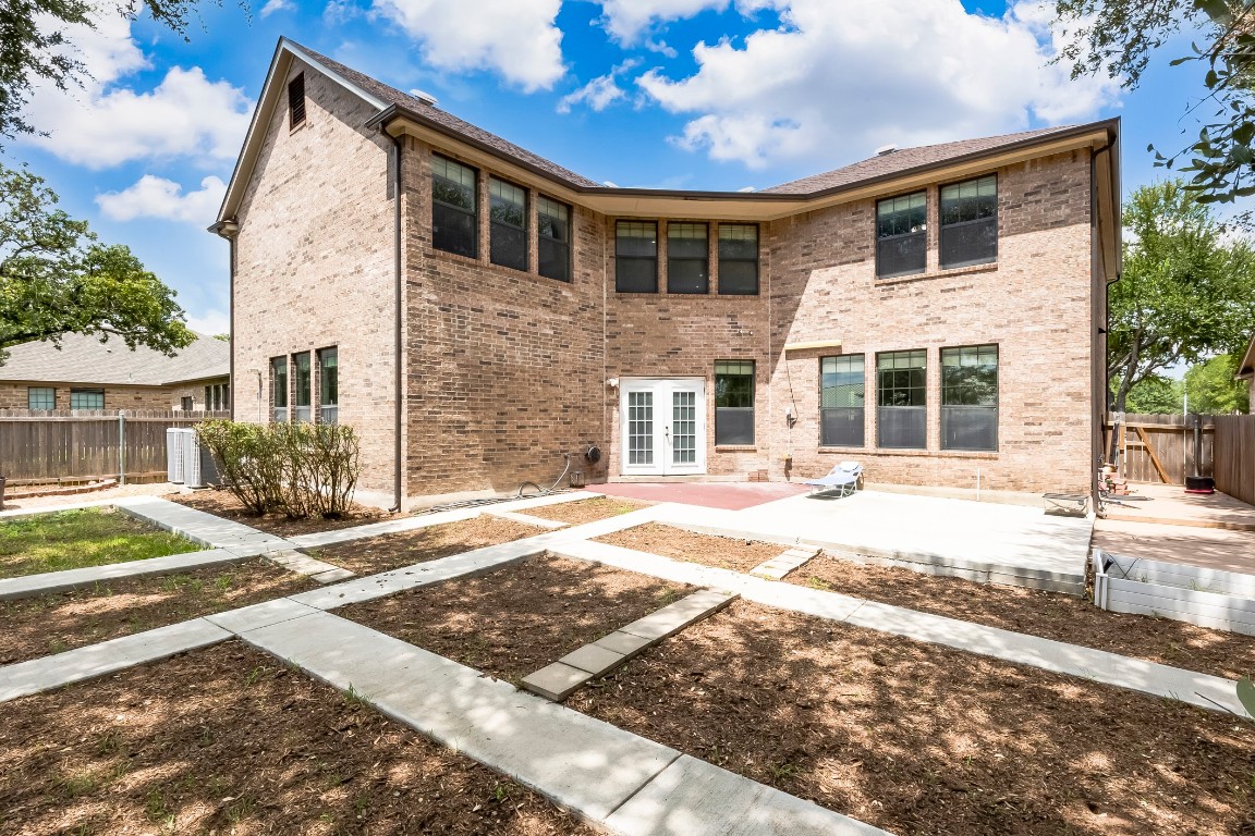 2310 McKendrick Drive Cedar Park, TX 78613 - Photo 28 of 32 a front view of a house with a yard