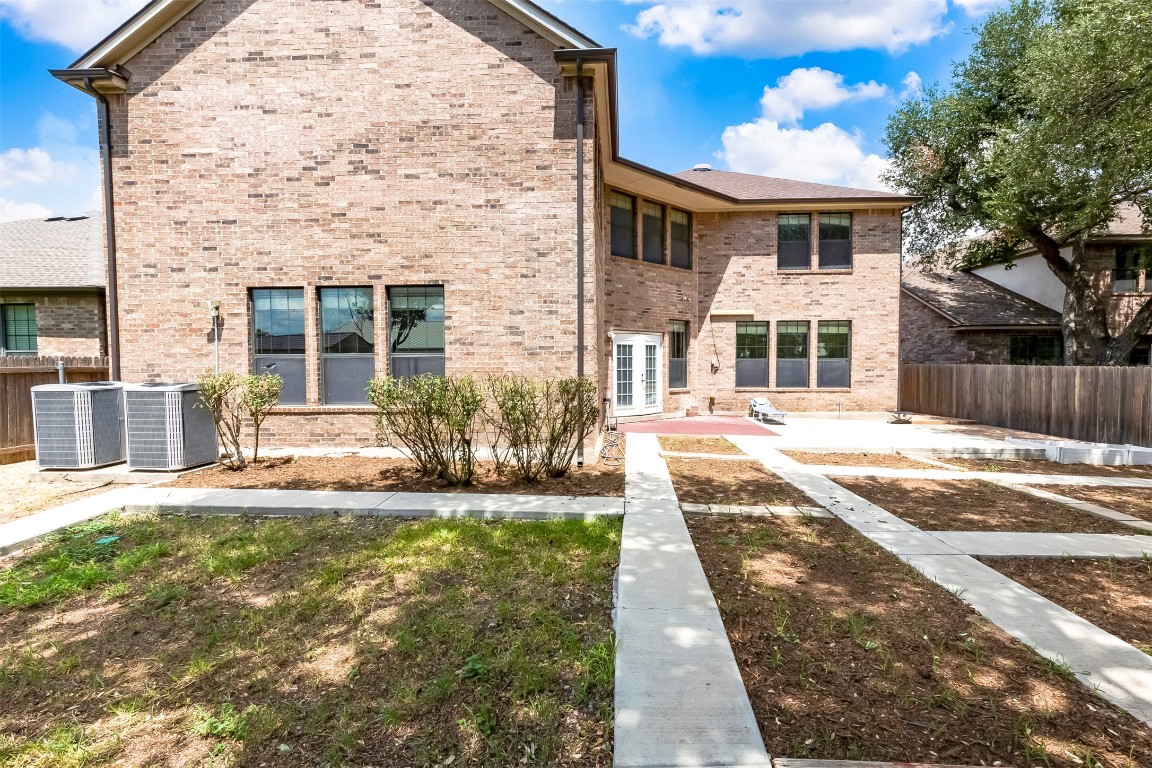 2310 McKendrick Drive Cedar Park, TX 78613 - Photo 29 of 32 a front view of a house with a yard