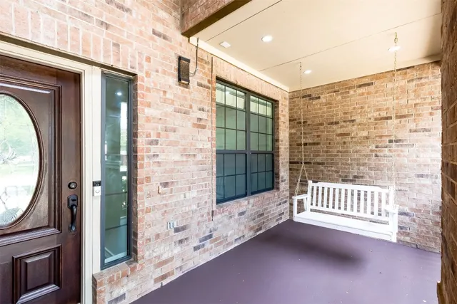 a view of hallway with wooden floor