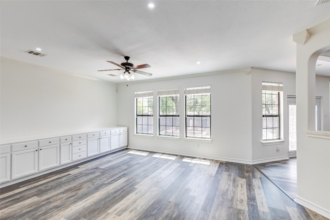 2310 McKendrick Drive Cedar Park, TX 78613 - Photo 7 of 32 a view of an empty room with a window and wooden floor
