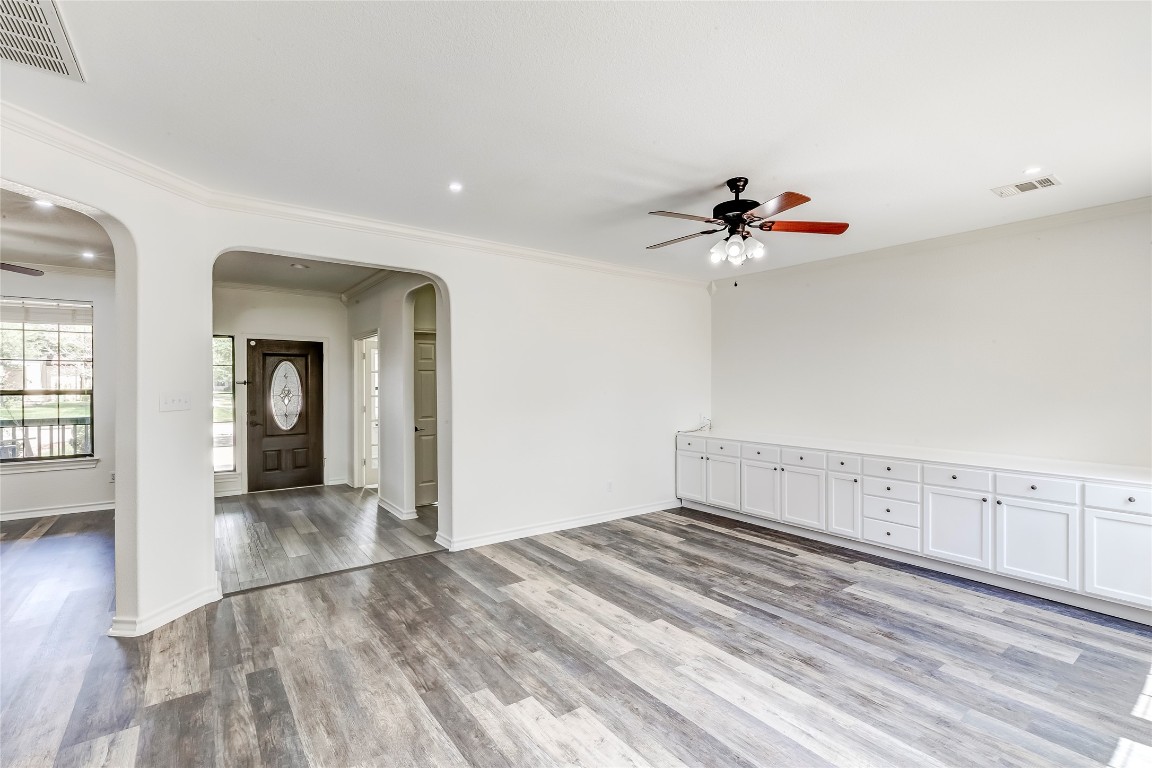 2310 McKendrick Drive Cedar Park, TX 78613 - Photo 8 of 32 wooden floor in an empty room with a window