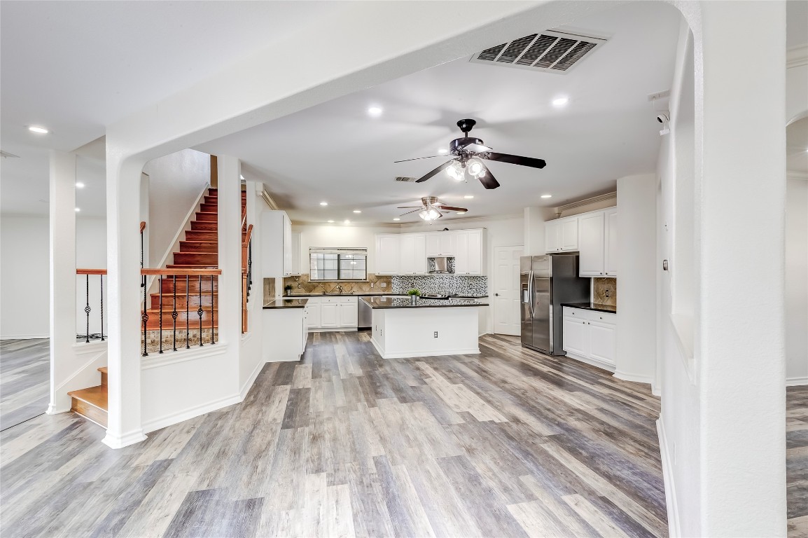 2310 McKendrick Drive Cedar Park, TX 78613 - Photo 10 of 32 a view of kitchen with cabinets and wooden floor