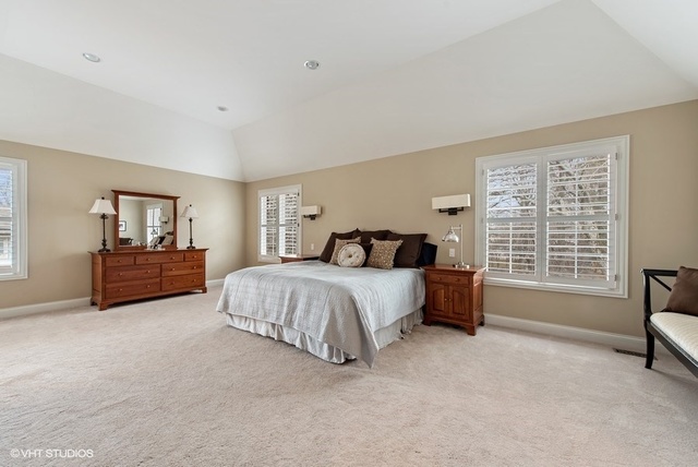 Undisclosed Address Deerfield, IL 60015 - Photo 15 of 34 a spacious bedroom with a bed and glass door