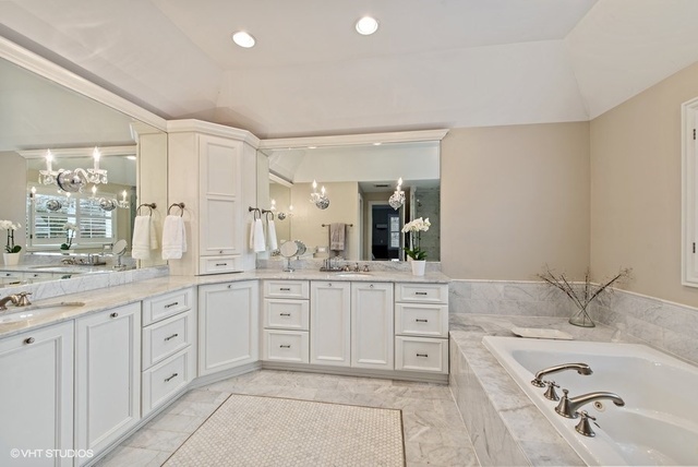 Undisclosed Address Deerfield, IL 60015 - Photo 16 of 34 a bathroom with a granite countertop sink and a mirror