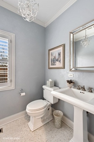 Undisclosed Address Deerfield, IL 60015 - Photo 27 of 34 a bathroom with a toilet a sink and a window
