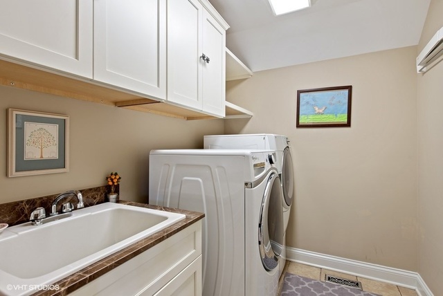 Undisclosed Address Deerfield, IL 60015 - Photo 28 of 34 a utility room with dryer and washer