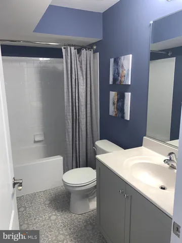 a room with furniture and a large window