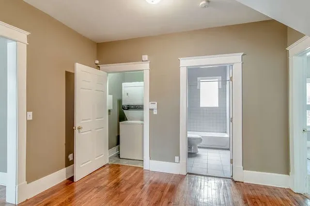 a view of wooden floor in an empty room