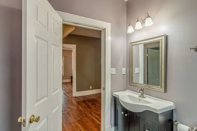 a bathroom with a sink and a mirror