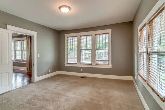a view of an empty room with a window