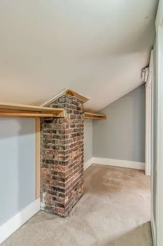 a bathroom with a sink vanity and a toilet