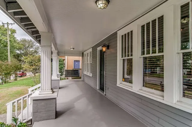 a view of a porch with wooden floor and outer view