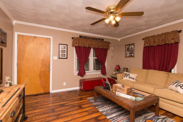 5124 Pineywoods Road Adams, TN 37010 - Photo 3 of 20 You enter the home in the living room that provides rustic laminate floors.