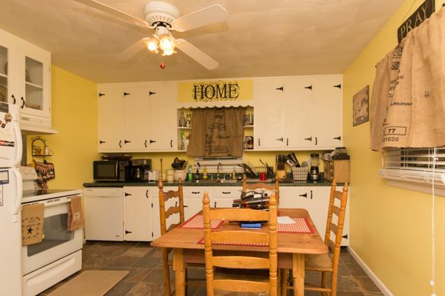 5124 Pineywoods Road Adams, TN 37010 - Photo 6 of 20 Cute country style kitchen with glass windows in some cabinets.