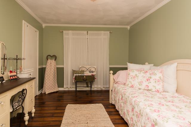 5124 Pineywoods Road Adams, TN 37010 - Photo 9 of 20 Bedroom #2 is absolutely adorable with it's crown molding, chair rail & lg closet.