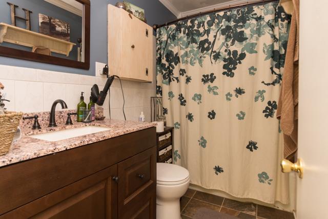5124 Pineywoods Road Adams, TN 37010 - Photo 10 of 20 Hall bath has NEW vanity with granite counter top & tile flooring.