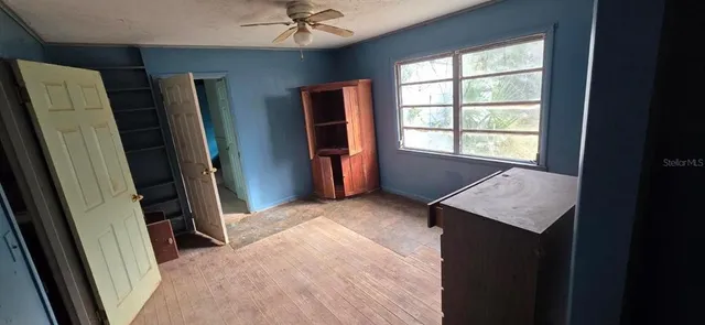 a view of an empty room with a fireplace