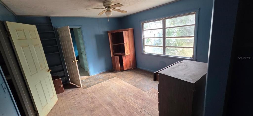 305 16th Avenue Ocoee, FL 34761 - Photo 11 of 20 a view of an empty room with a fireplace
