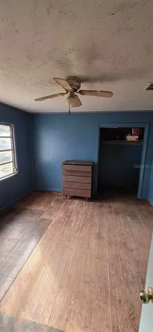 a view of empty room with a fireplace