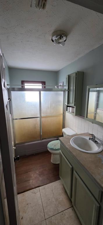 305 16th Avenue Ocoee, FL 34761 - Photo 7 of 20 a bathroom with a toilet sink and mirror