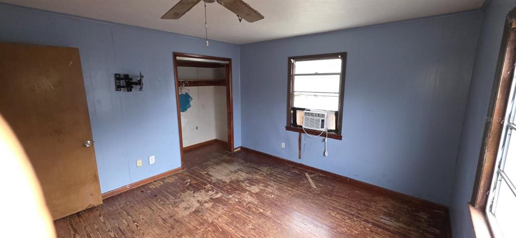 305 16th Avenue Ocoee, FL 34761 - Photo 8 of 20 an empty room with windows and closet
