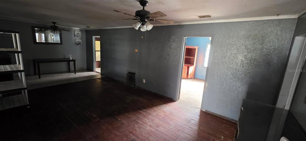 305 16th Avenue Ocoee, FL 34761 - Photo 9 of 20 wooden floor in an empty room with a window