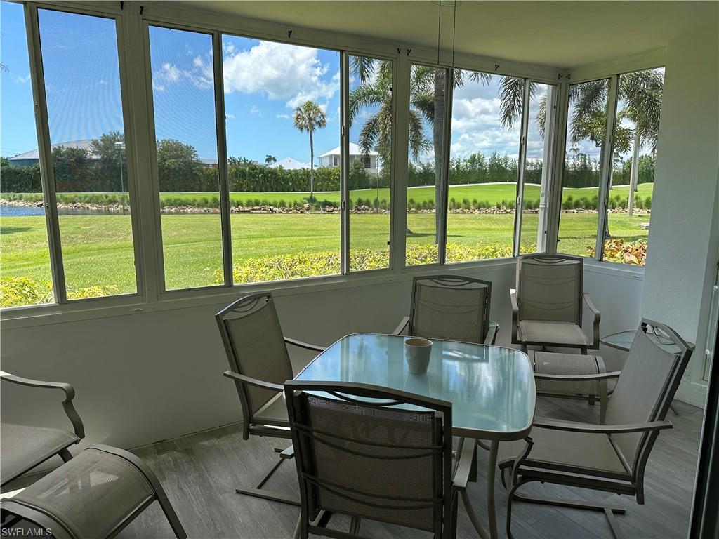 231 Memory Lane, Unit 3 Naples, FL 34112 - Photo 27 of 27 a view of a dining room with furniture window and outside view