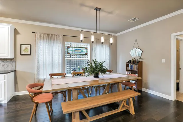 a dining room with furniture and window