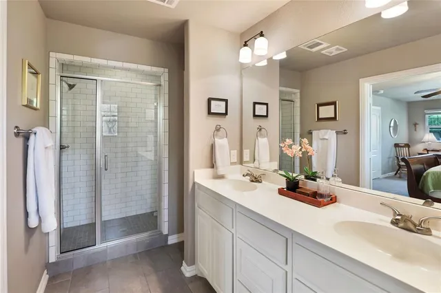 a view of a dining room with furniture and a chandelier fan