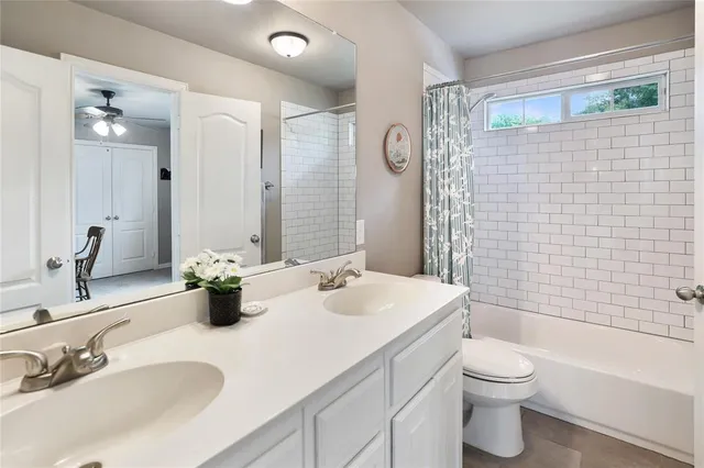 a living room with furniture and a lamp