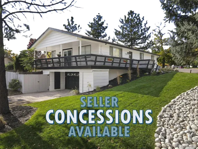 a front view of a house with a garden and deck